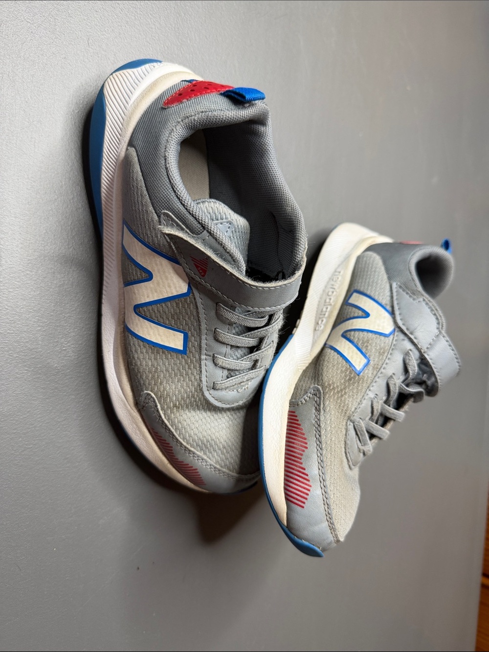 New Balance Kids Grey, Blue and Red Athletic Sneakers. Size: 2.5